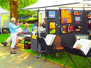 people at an art fair in Bar Harbor, one of the popular towns on Maine Route 1