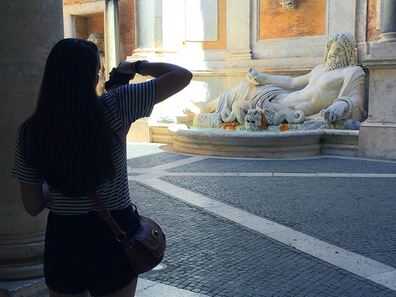 a large statue in a fountain