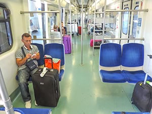 man in a train reading a book