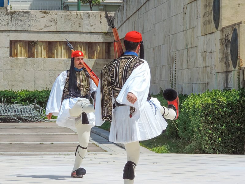 palace guards in ancient uniforms marching