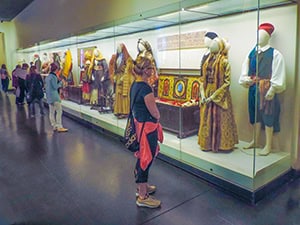 people looking at a museum exhibit 