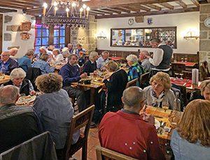 people in a restaurant in a Mont St. Michel hotel