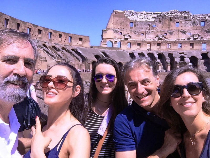 a group photo in the Coloseum, one of the places to visit in Rome