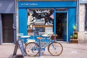 a bicycle in front of a cafe