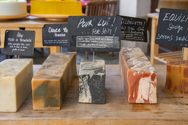 cheesees in a shop seen on a trip to Normandy from Paris