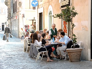 people at an outdoor restaurant in Rome