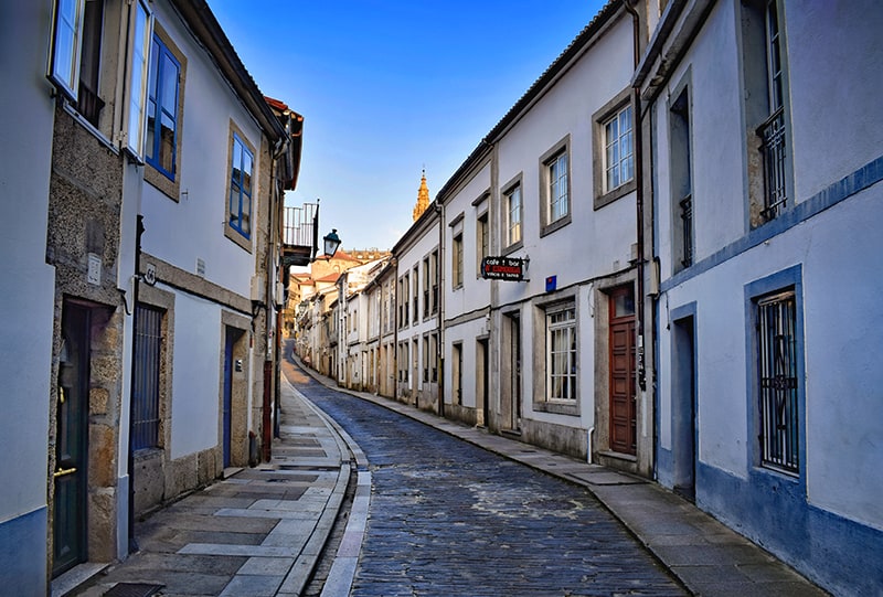 old buildings along a street in a city that's good for those wanting to enjoy the benefits of wellness travel