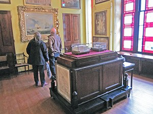 people looking at a museum exhibit