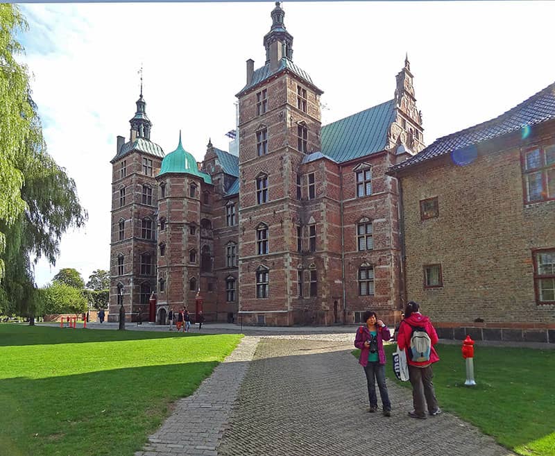 people by an old castle