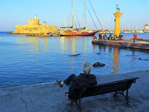 Relaxing by the harbor in Rhodes town, one of the things to do in Rhodes