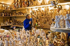 a woodcarver at a German Christmas market