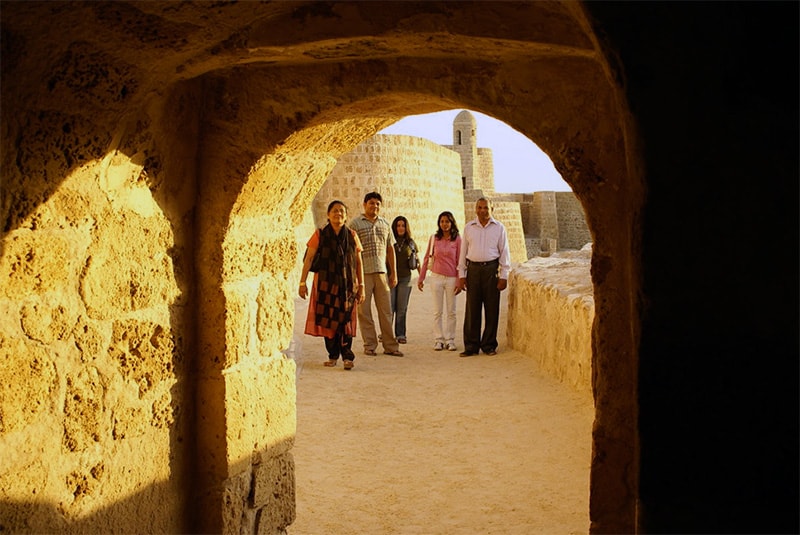 people in an old fort, one of the things to do in Bahrain