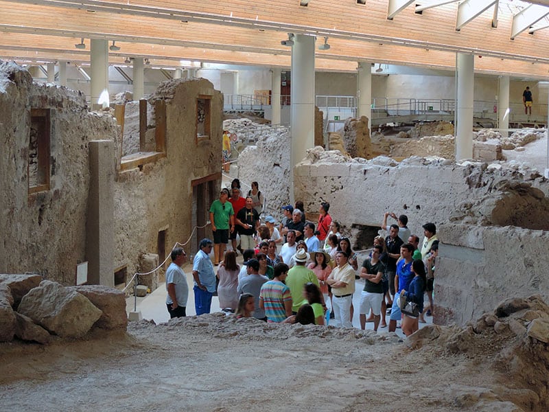 people on an archeological tour - what to do in Santorini