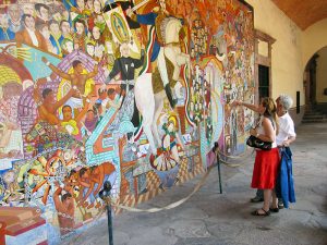 couple travel - couple looking at a mural
