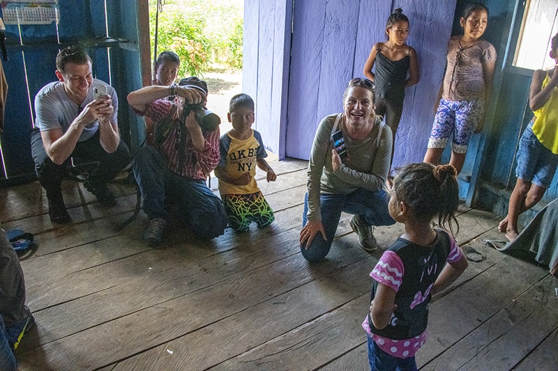 people with schoolcbildren while on our luxury Amazon River cruise