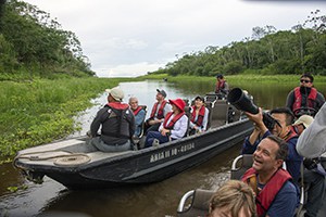 people on skiffs on our luxury Amazon River cruise