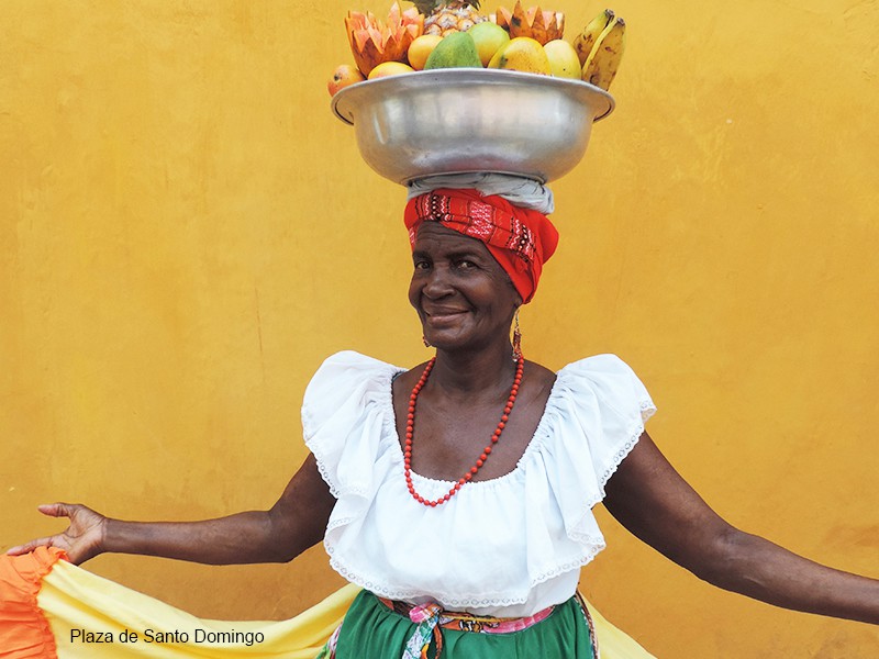 Photos of Cartagena Colombia - a woman with fruit on her head