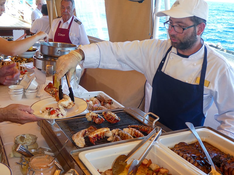 people at a buffet on a Sea Cloud cruise