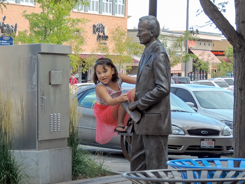 girl on a statue - seen on a South Dakota road trip