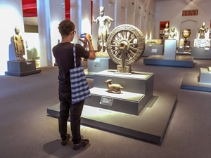 a person in a museum, one of the things to see on a 4-day Itinerary in Bangkok