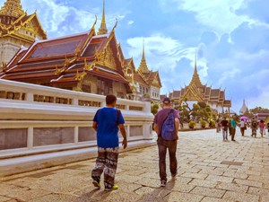 people walking by the Grand Palace, one of the things to see on a 4-day Itinerary in Bangkok