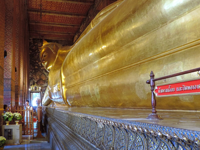people by a huge Buddha, one of the things to see on a 4-day Itinerary in Bangkok