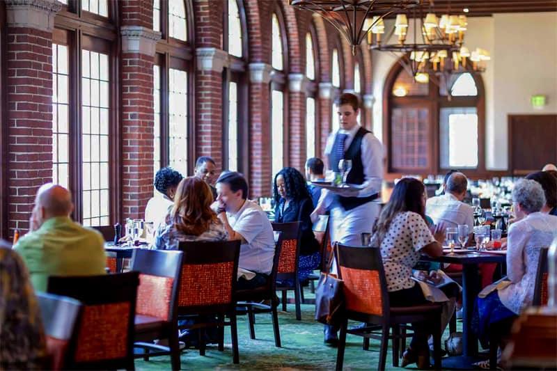 a waiter in a busy restaurant in teh Hudson Valley