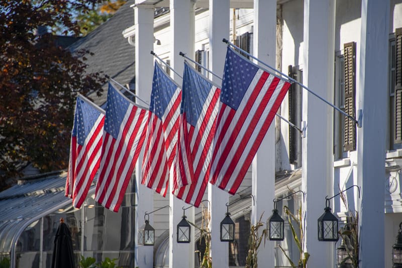 flags outside a large building in the Hudson Valley