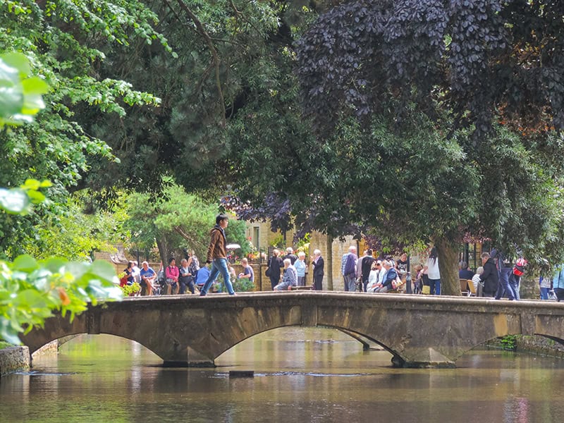 people by a walking bridge seen on day trips from London 
