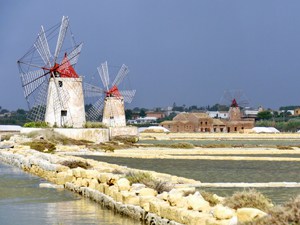 white windmills on salt flats