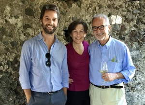 three people smiling for the camera