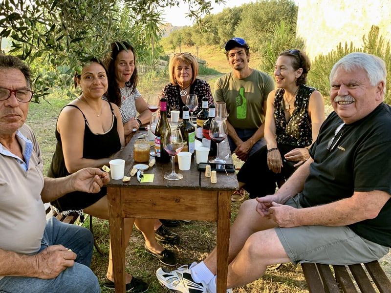 people tsting wines at wineries in sicily