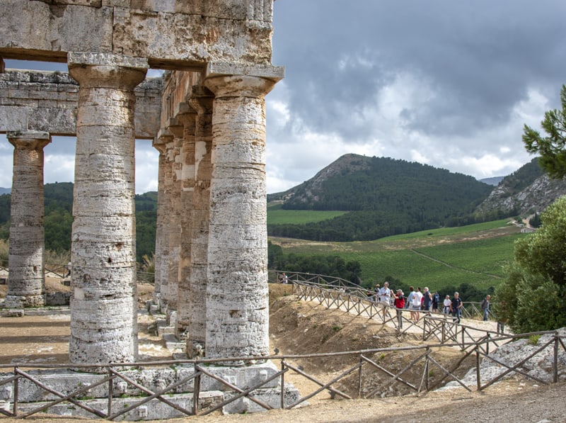 an ancient Greek temple by wineries in sicily