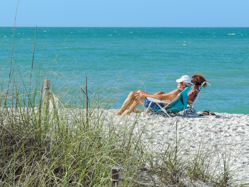 people relaxing on a beach on a Florida Gulf Coast road trip