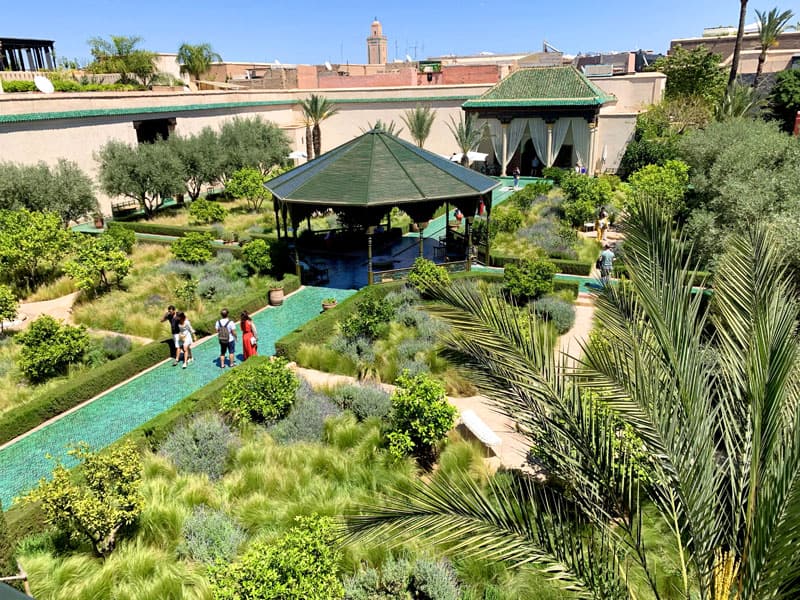 people walking through a large garden