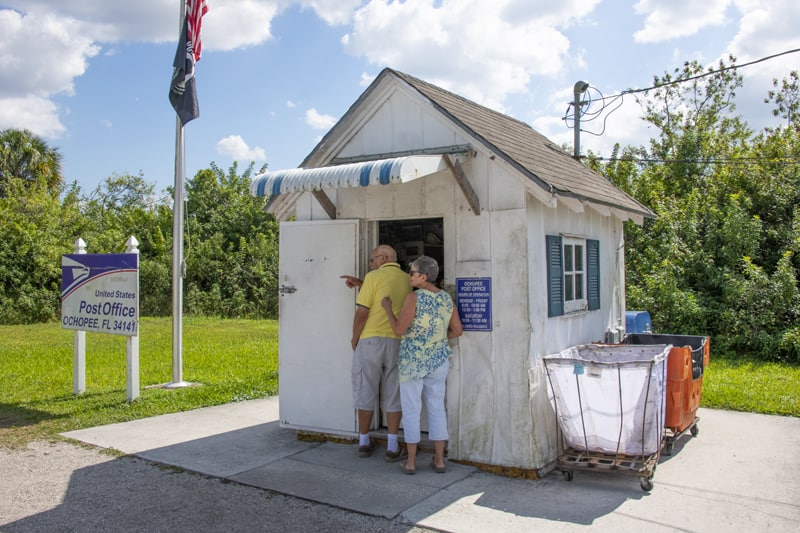 people visiting the smallest post office in the U.S. on a Florida Gulf Coast road trip