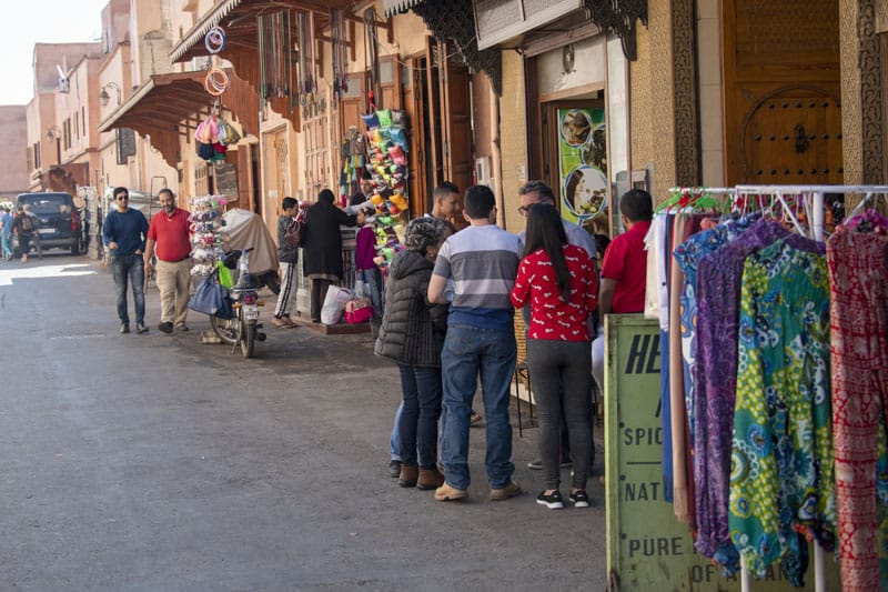 people on a street talking