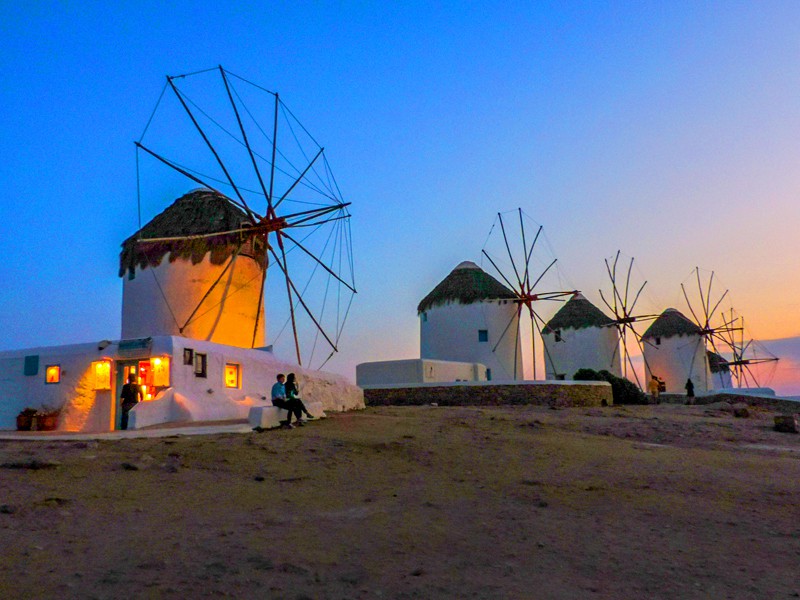 windmills at sunset in old town Mykonos