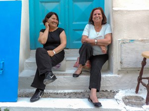 two women on steps in old town Mykonos