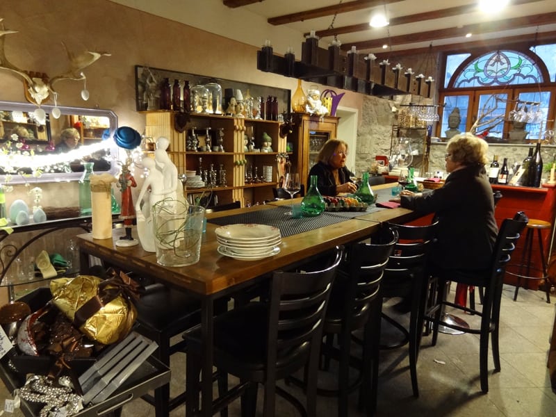 women at a table in a Fussen boutique