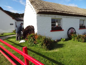 a white building and red fence