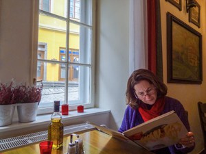 woman looking at a restaurant menu
