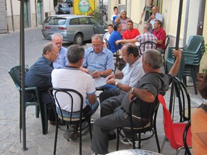 men at a table playing cards in Accettura, the ancestral of my family in Italy