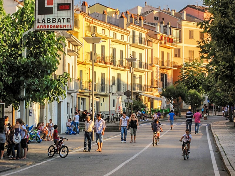 people on a street in Accettura, the hometown of my ancestral family in Italy