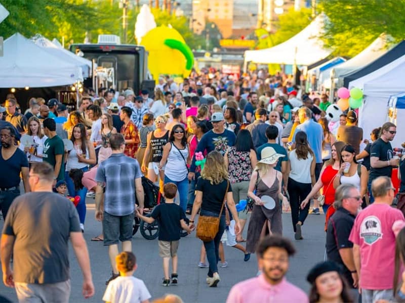 a crowd of people on an art walk