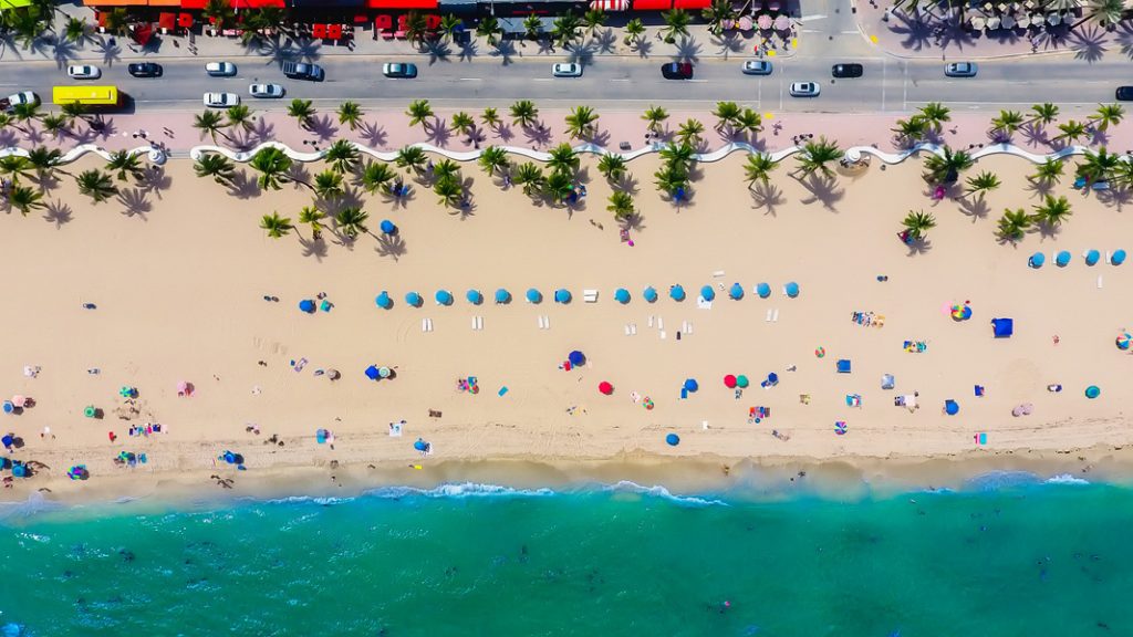 an aerial view of people on a beach - one of the fun things to do in Fort Lauderdale
