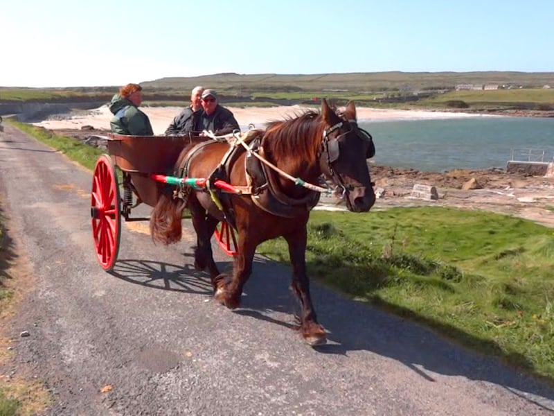 people in a horse cart on the Aran Island, Ireland