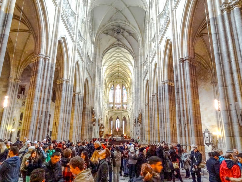 People in the a cathedral, one of the places to see on a 2 day itinerary in Prague