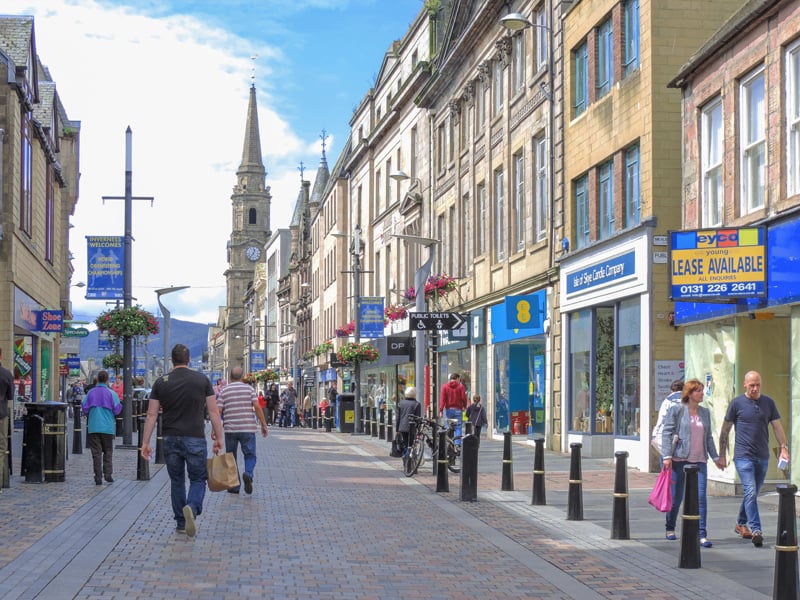 people walking along a pedestrian street seen on a Highlands of Scotland road trip