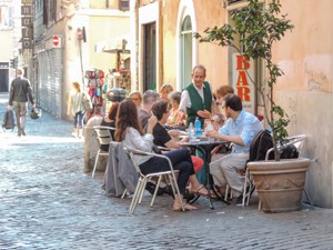 people in an outdoor restaurant seen on walks in Rome 